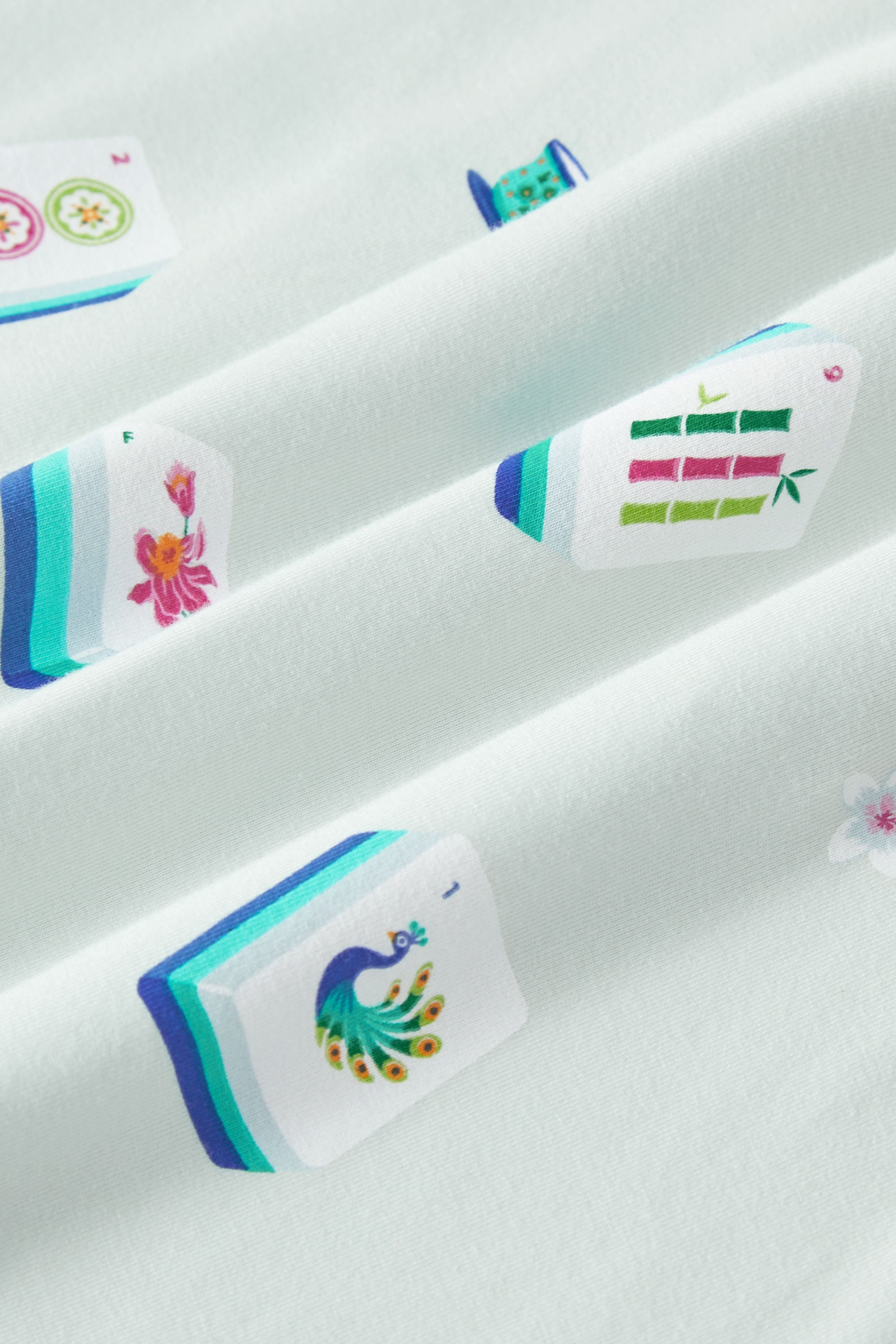 Close up of Mahjong print on Blue Fabric