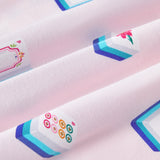 An all-over print featuring: white Mahjong tiles with a navy and turquoise back and various artworks; white jasmine flowers with pink centers and green leaves; white dice with pink, turquoise, and green markings; and pink teacups with navy trim, over a pale pink background color named Sakura.