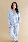 Woman wearing a light blue pajama set with pink accents with a Mahjong pattern on a beige background ::: Model is 5'6" wearing size M ///