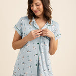 Woman wearing a light blue pajama set with duck print on a beige background ::: Model is 5'5" wearing size S ///