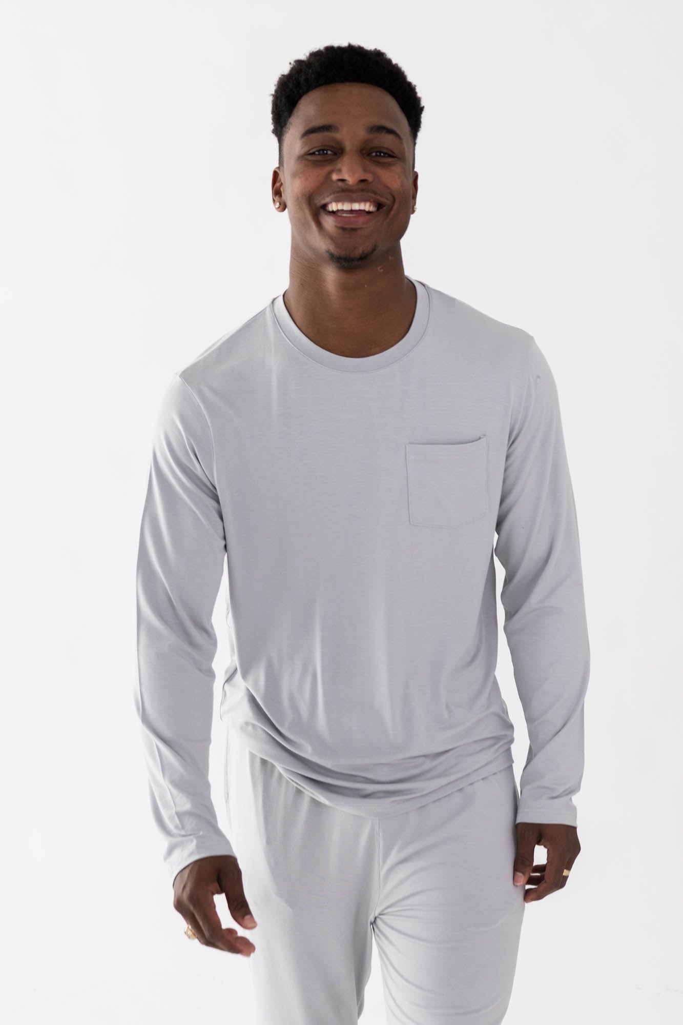 Smiling model wearing the Men's Jogger Set in Storm