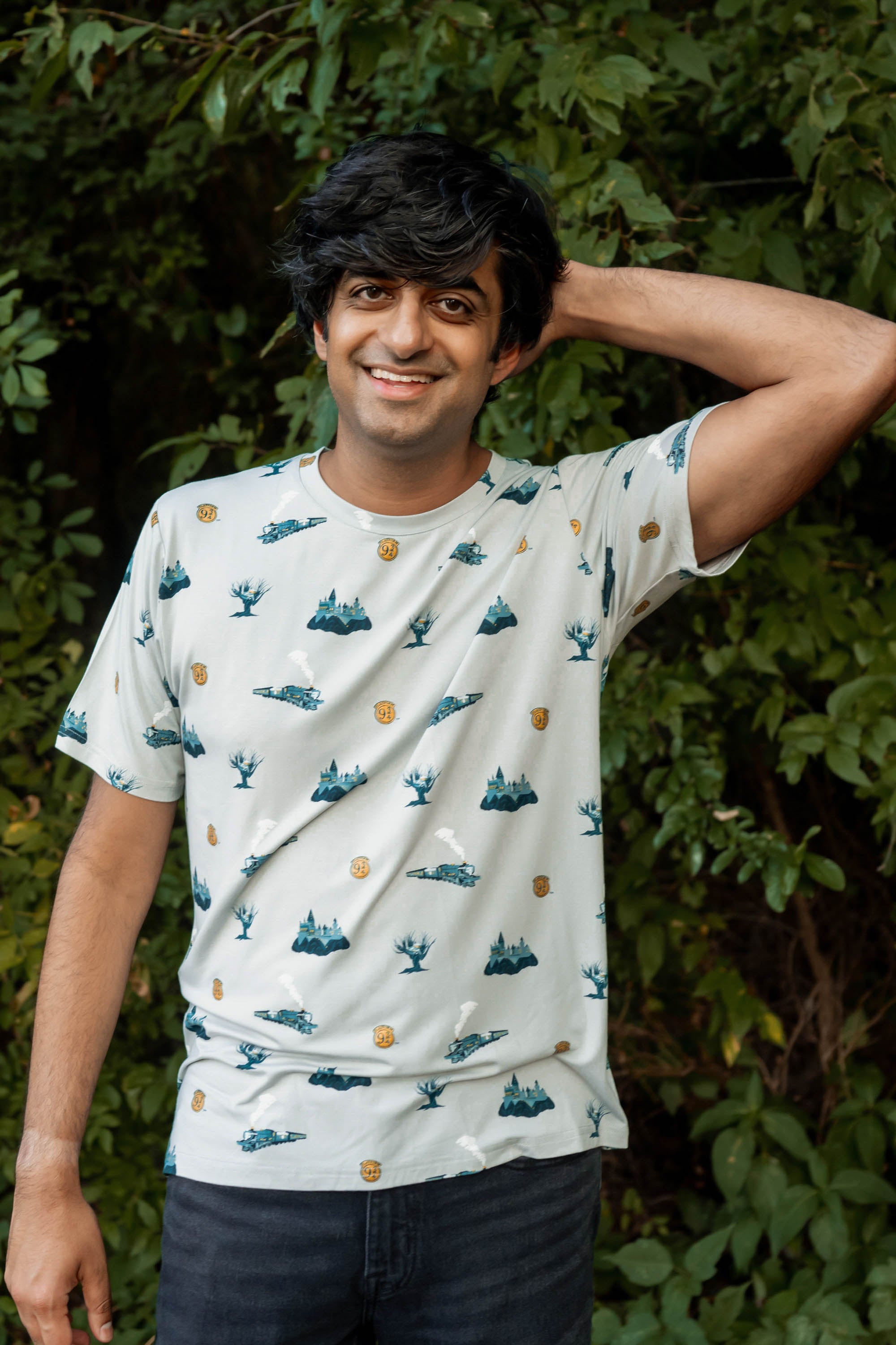 Male model wearing the Men's Crew Neck Tee in Journey with one arm up and behind his head