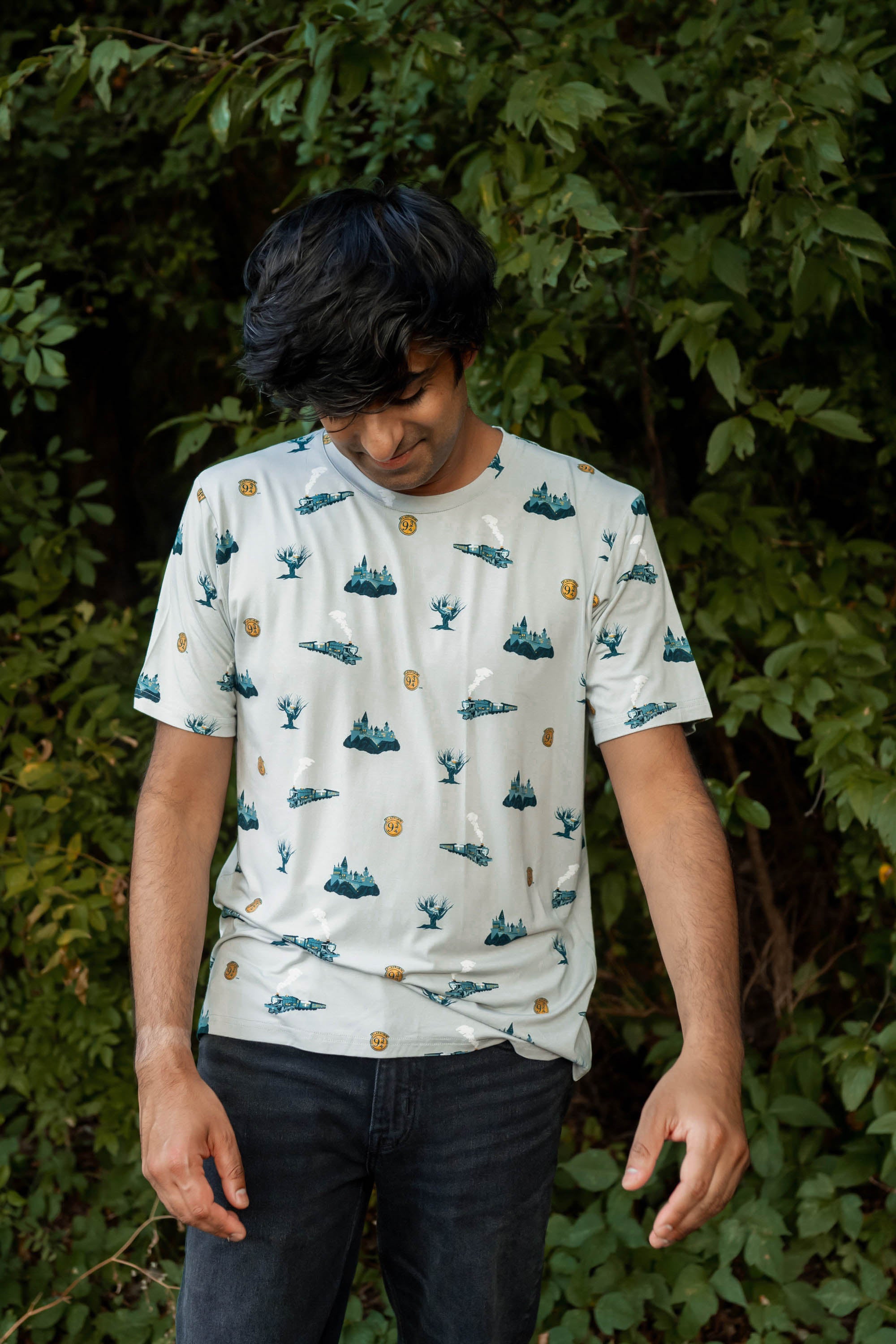 Male model wearing the Men's Crew Neck Tee in Journey with dark wash denim