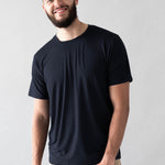 Male model wearing the Men's Crew Neck Tee in Midnight with Khaki colored pants