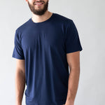Male model wearing the Men's Crew Neck Tee in Navy with khaki colored pants