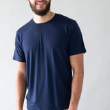 Male model wearing the Men's Crew Neck Tee in Navy with khaki colored pants