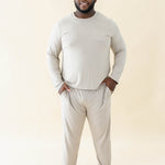 Male model wearing the Men's Jogger Set in Almond with both hands in pockets
