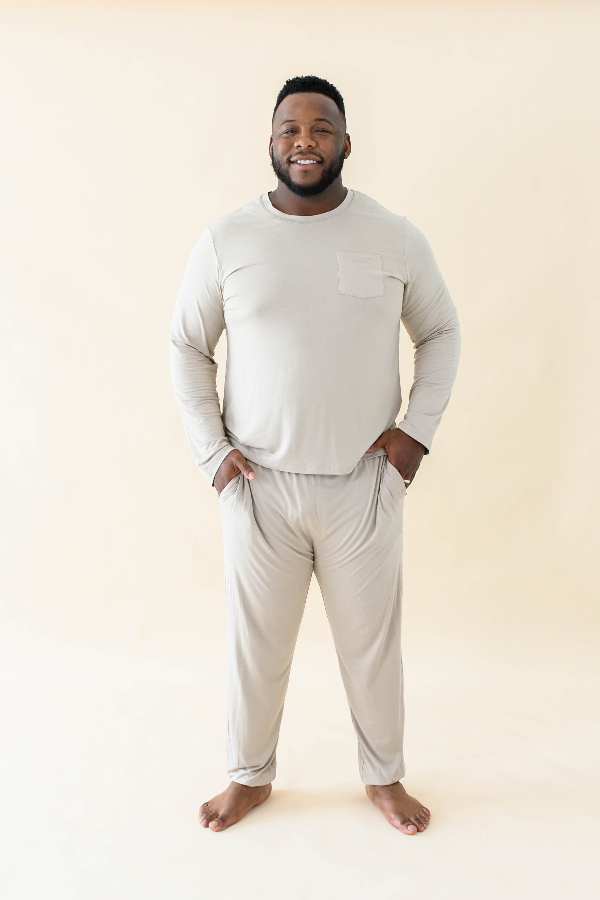 Male model wearing the Men's Jogger Set in Almond with both hands in pockets