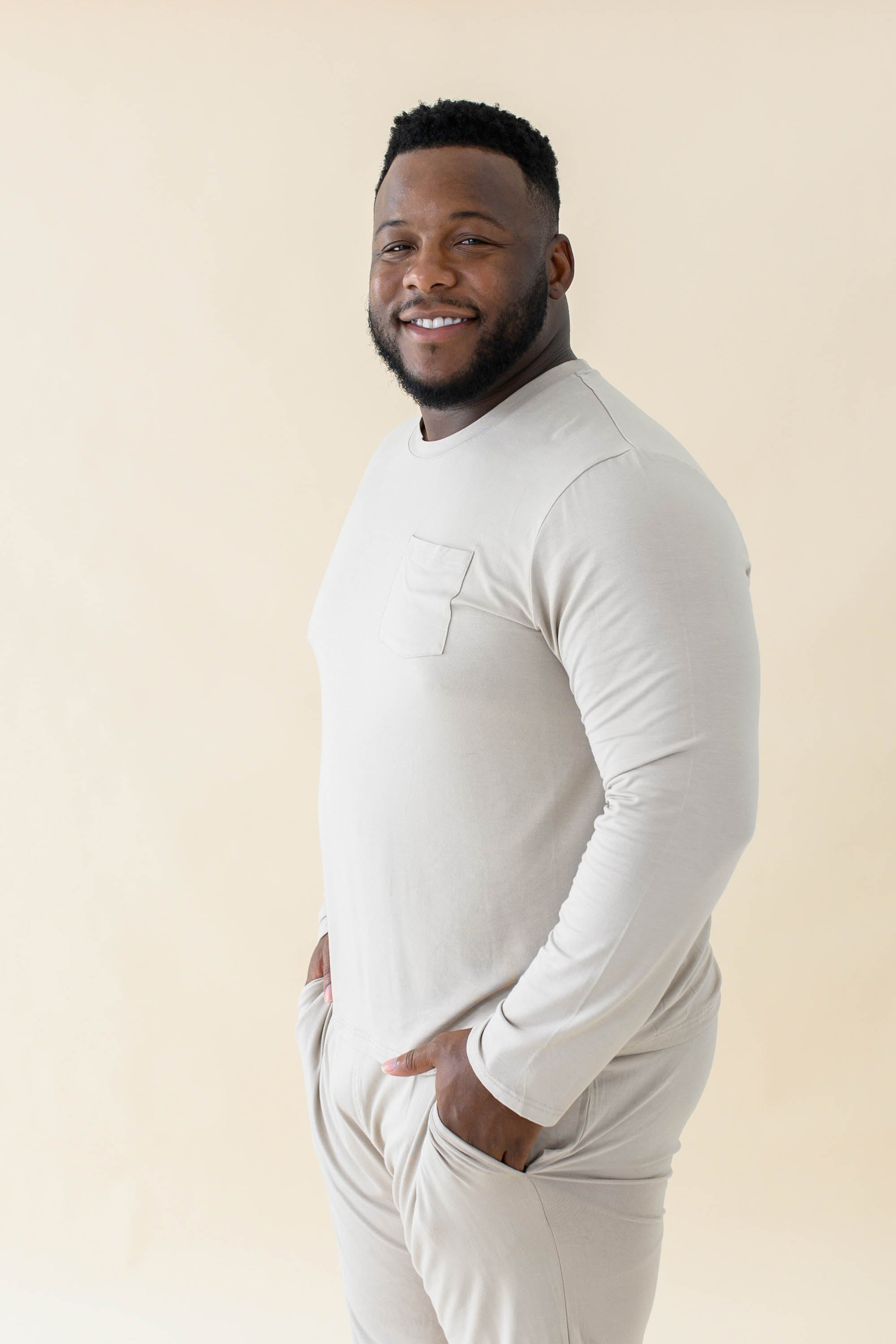 Male model wearing the Men's Jogger Set in Almond with both hands in pants pockets