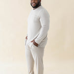 Smiling male model wearing the Men's Jogger Set in Almond with both hands in pants pockets