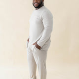Smiling male model wearing the Men's Jogger Set in Almond with both hands in pants pockets