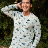 Smiling male model wearing the Men's Jogger Set in Journey with one hand in the pants pocket and one hand up and behind his head