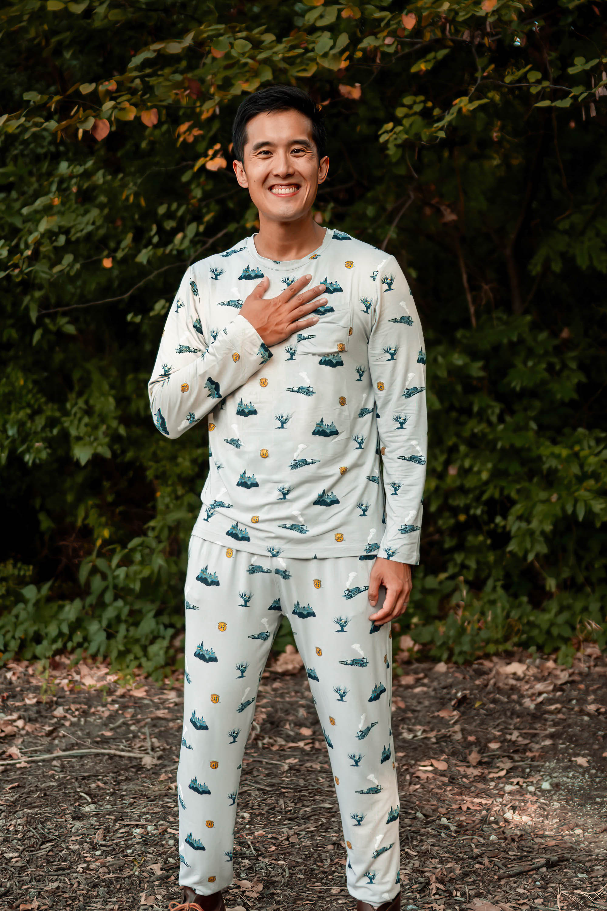 Smiling male model wearing the Men's Jogger Set in Journey with one hand on his chest