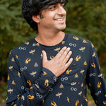 Smiling model wearing the Men's Jogger Set in Midnight Icon with one hand on his chest