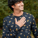 Smiling model wearing the Men's Jogger Set in Midnight Icon with one hand on his chest