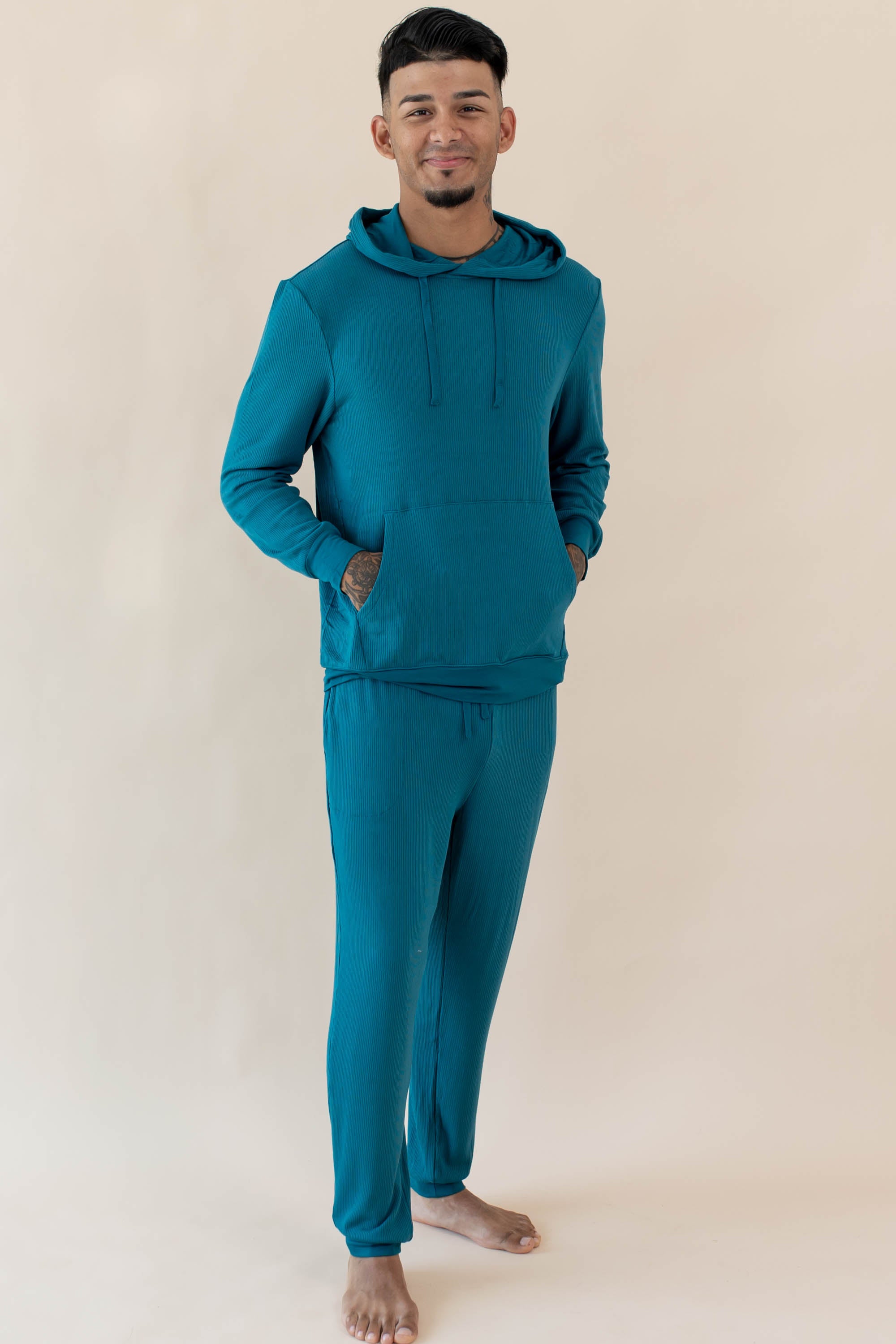 Male wearing the Men's Ribbed Jogger Pant in Loch and Men's Ribbed Hoodie in Loch