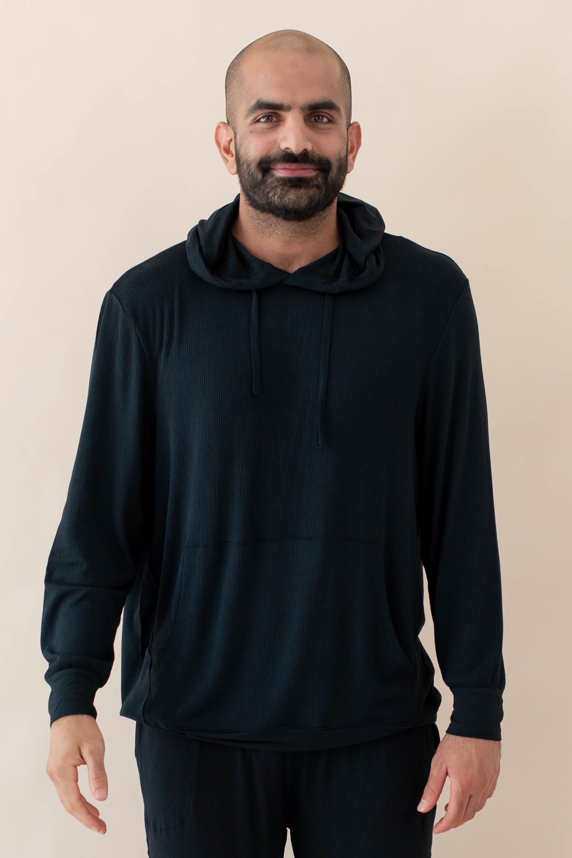 Male model wearing the Men's Ribbed Hoodie in Midnight