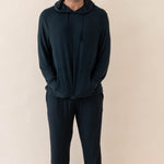 Male model wearing the Men's Ribbed Jogger Pant in Midnight and Ribbed Hoodie in Midnight 