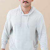 Male model wearing the Men's Ribbed Hoodie in Oat