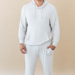 Male model wearing the Men's Ribbed Jogger Pant in Oat and Men's Ribbed Hoodie in Oat