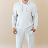 Male model wearing the Men's Ribbed Jogger Pant in Oat and Men's Ribbed Hoodie in Oat