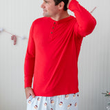 Male model wearing the Men's Long Sleeve Henley Top in Cardinal