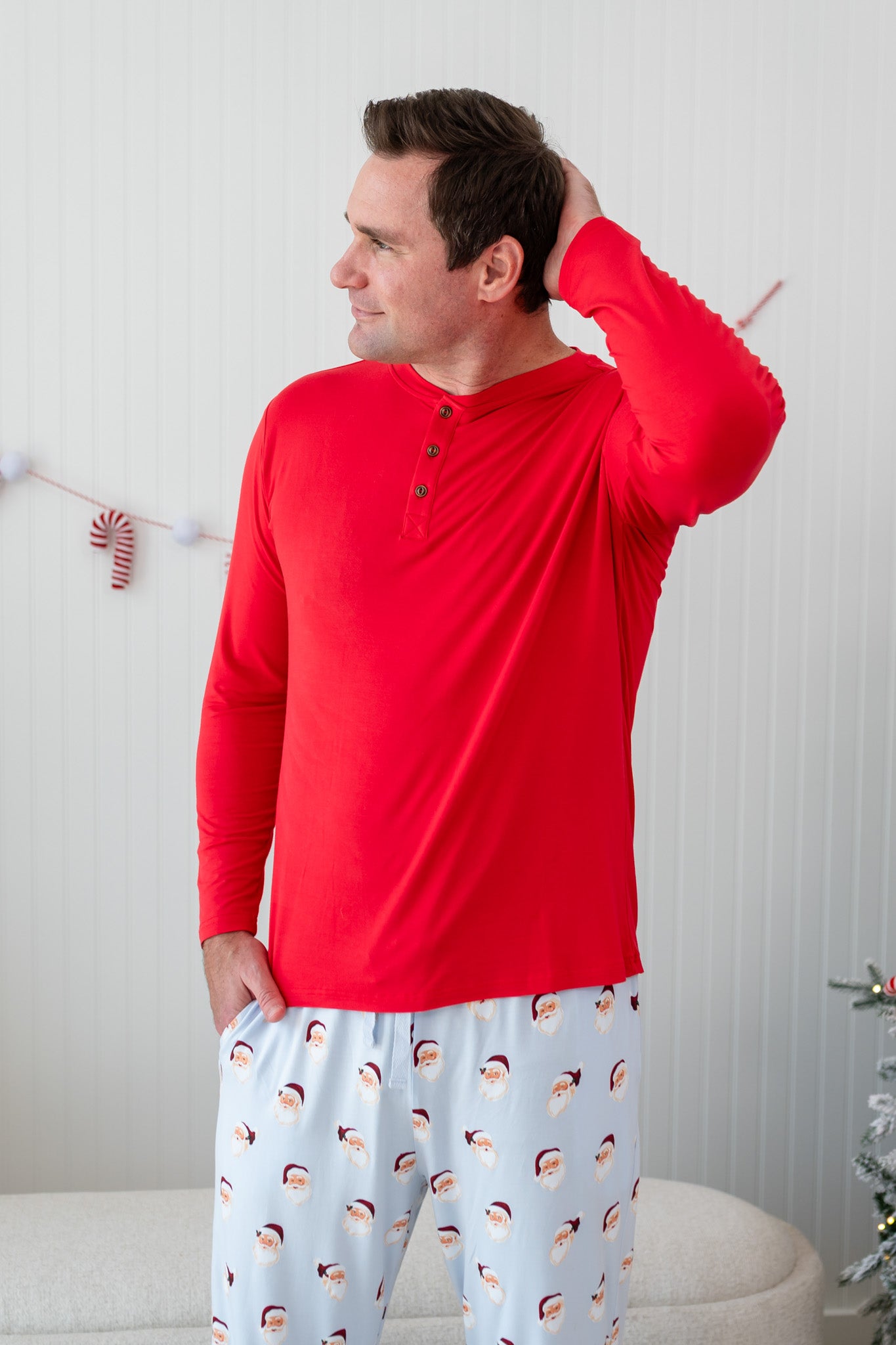 Male model wearing the Men's Long Sleeve Henley Top in Cardinal