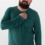 Male model wearing the Men's Jogger Set in Emerald with one hand on his chest