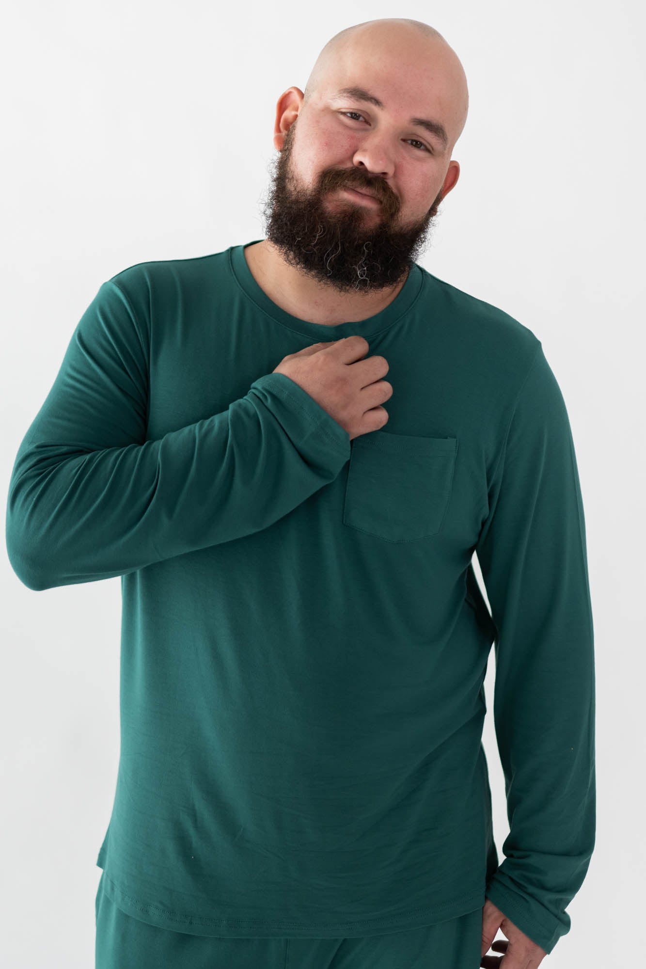 Male model wearing the Men's Jogger Set in Emerald with one hand on his chest