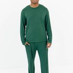 Smiling male model wearing the Men's Jogger Set in Evergreen with one hand in the pants pocket