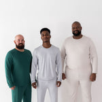 Three male models wearing various colors in the Men's Jogger Sets