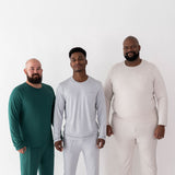 Three male models wearing various colors in the Men's Jogger Sets