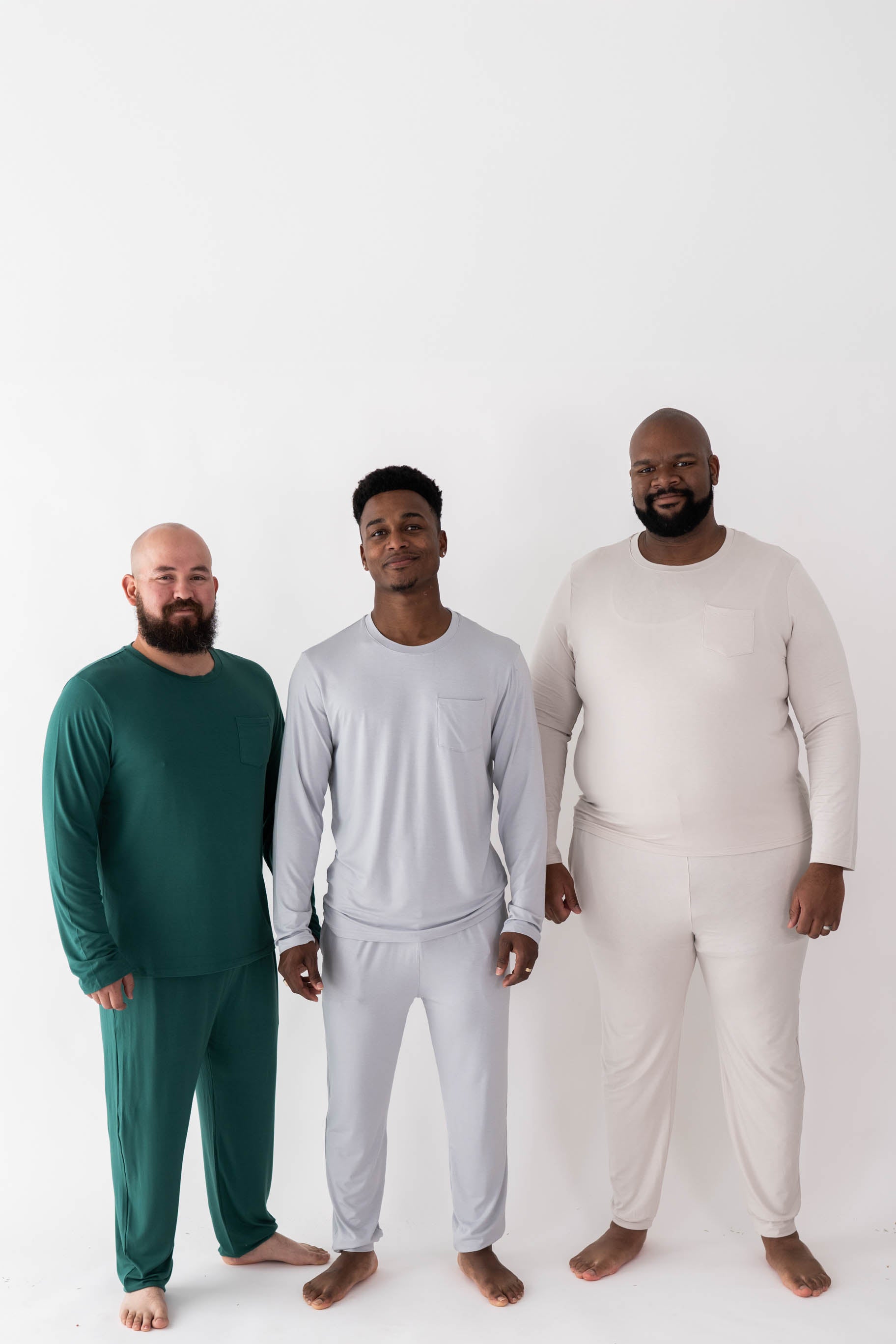 Three male models wearing various colors in the Men's Jogger Sets