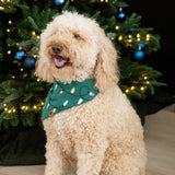Medium sized dog sitting wearing the Dog Bandana in Merry and Bright in front of a decorated Christmas Tree