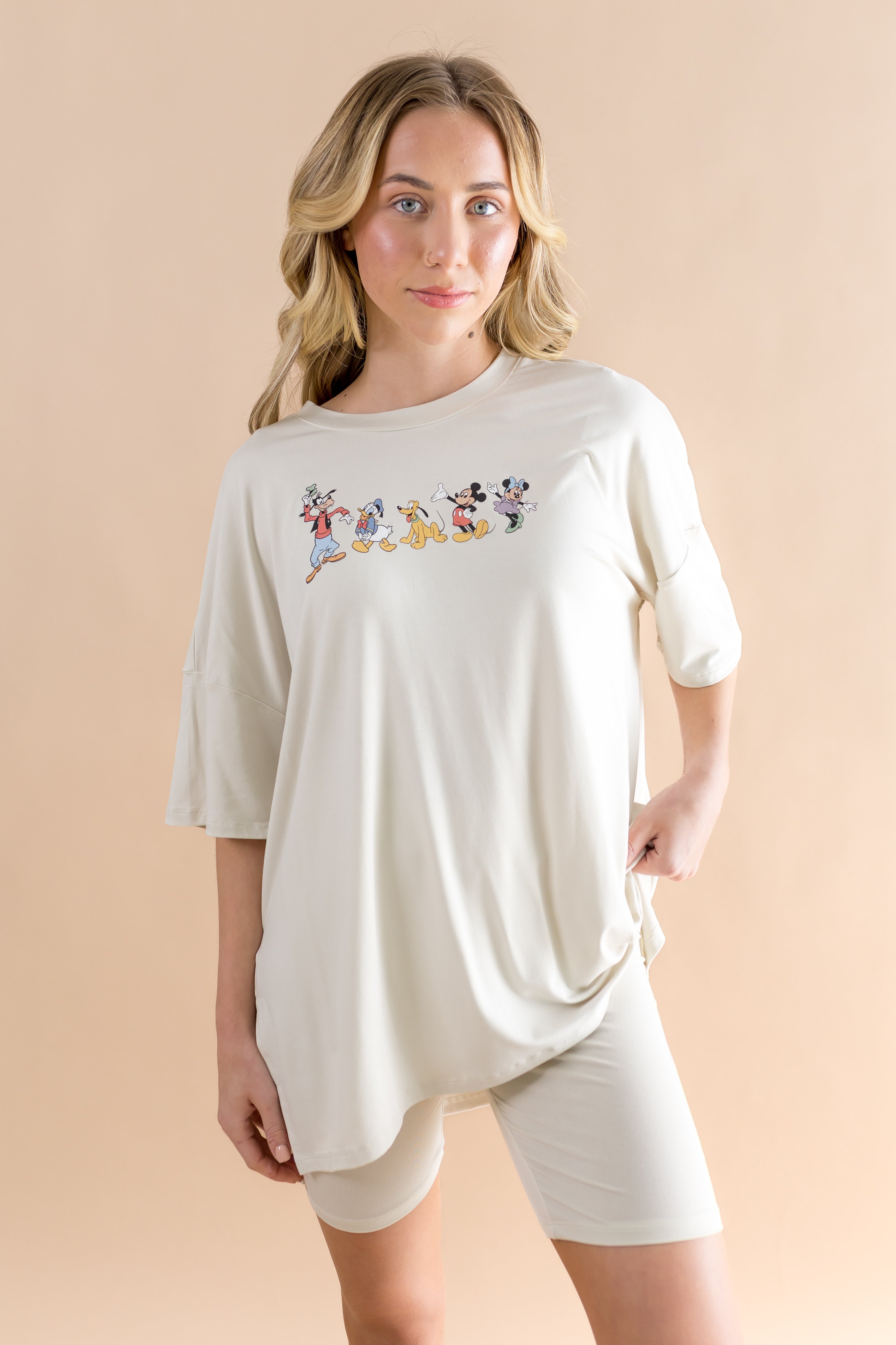 Woman modeling the Kyte Women’s Biker Short Set in Mickey and Friends on Ecru ::: Model is 5'7" wearing size S ///