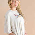 Close up of the model wearing the Women’s Biker Short Set in Mickey and Friends on Ecru