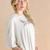Close up of the model wearing the Women’s Biker Short Set in Mickey and Friends on Ecru