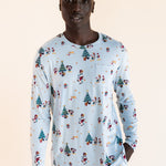 Man wearing Men's Jogger Set in Mickey & Friends Christmas print on a beige background