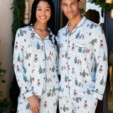 couple wearing matching christmas mickey and friends pajamas