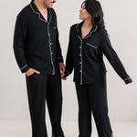 Couple holding hands wearing matching  Long Sleeve Pajama Sets in Midnight