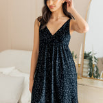 Model posing in Women's Nightgown in Midnight Leopard print standing in front of a dressing mirror.