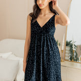 Model posing in Women's Nightgown in Midnight Leopard print standing in front of a dressing mirror.