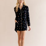 Model wearing Long Sleeve Women’s Nightshirt in Midnight Wildflower print on a beige background
::: Model is 5'9" wearing size XS ///