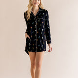 Model wearing Long Sleeve Women’s Nightshirt in Midnight Wildflower print on a beige background
::: Model is 5'9" wearing size XS ///
