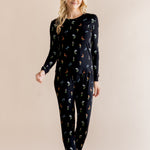 Model wearing Women's Jogger Pajama Set in Midnight Wildflower print on beige background ::: Model is 5'9" wearing size XS ///
