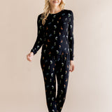 Model wearing Women's Jogger Pajama Set in Midnight Wildflower print on beige background ::: Model is 5'9" wearing size XS ///