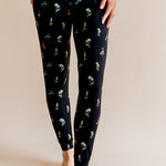 Model showing the Women's Jogger Pajama in Midnight Wildflower print on beige background