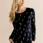 Model in Women's Jogger Pajama Set in Midnight Wildflower print on beige background