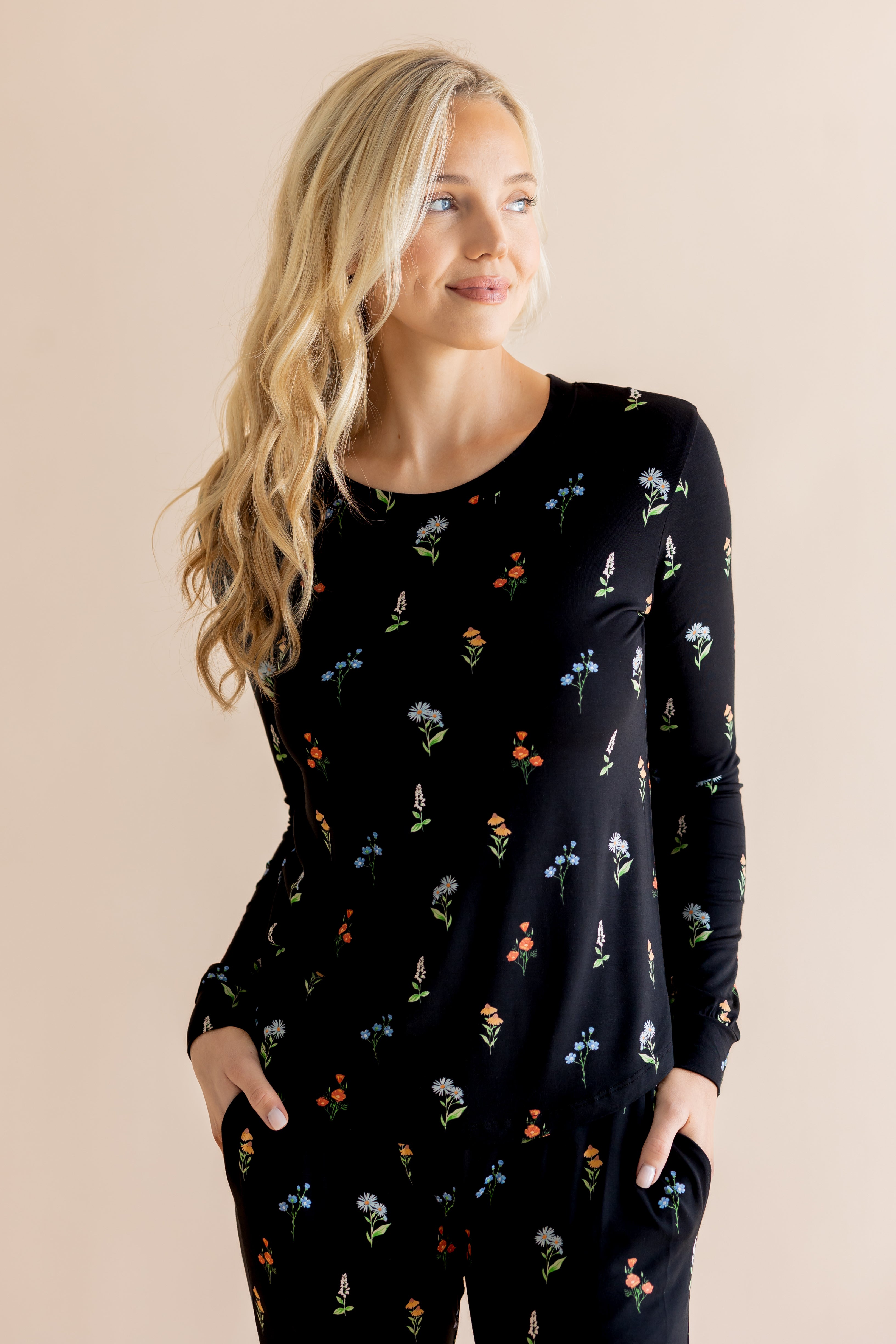 Model in Women's Jogger Pajama Set in Midnight Wildflower print on beige background