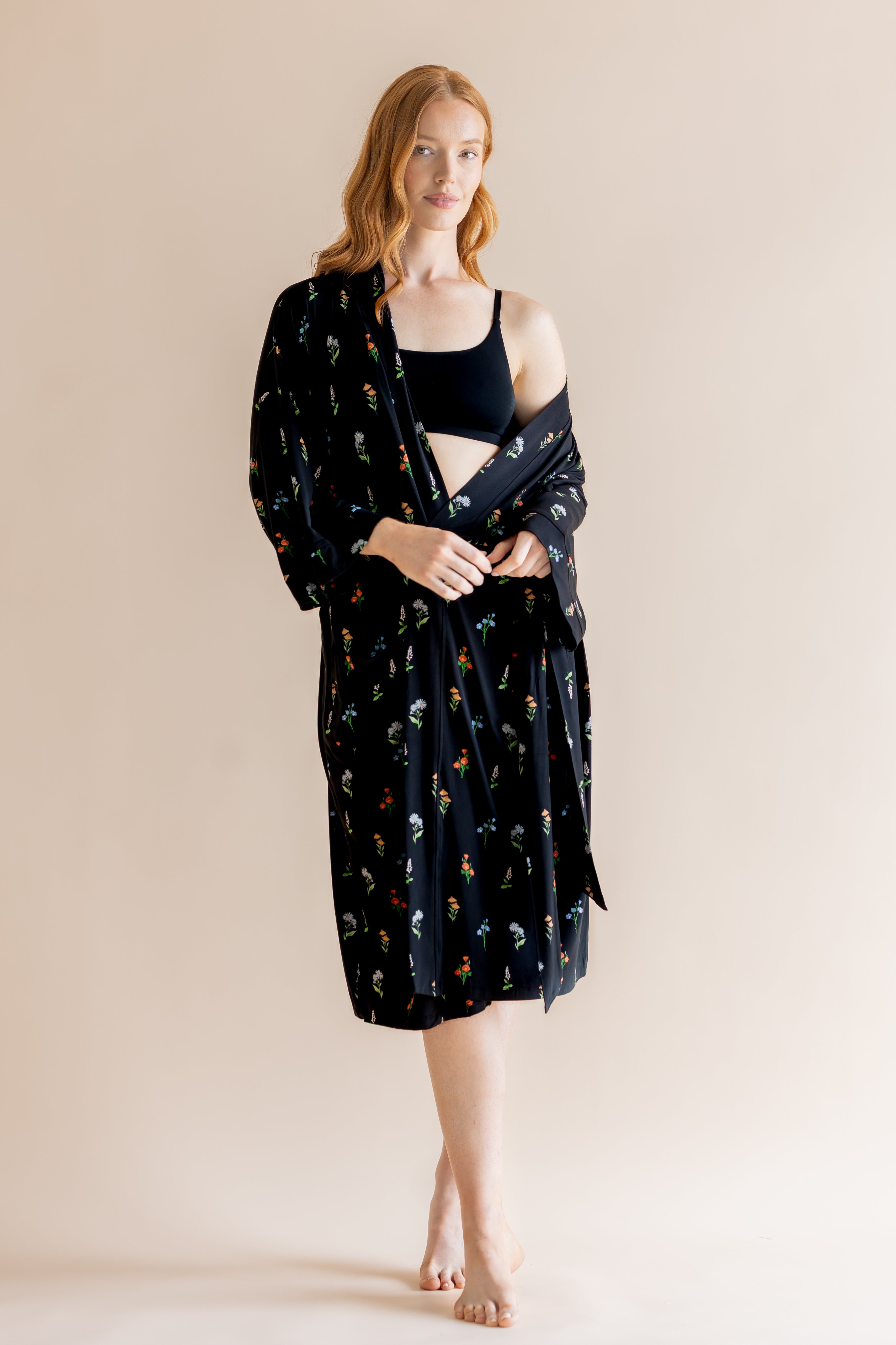 Model wearing Women’s Kimono Robe in Midnight Wildflower print and black bra on a beige background

::: Model is 5'8" wearing size XS/S ///
